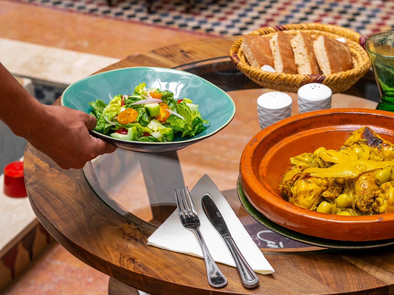 Moroccan table laid with tagine and salads by Chef Khadija at Riad Dar Alhambra, Marrakech