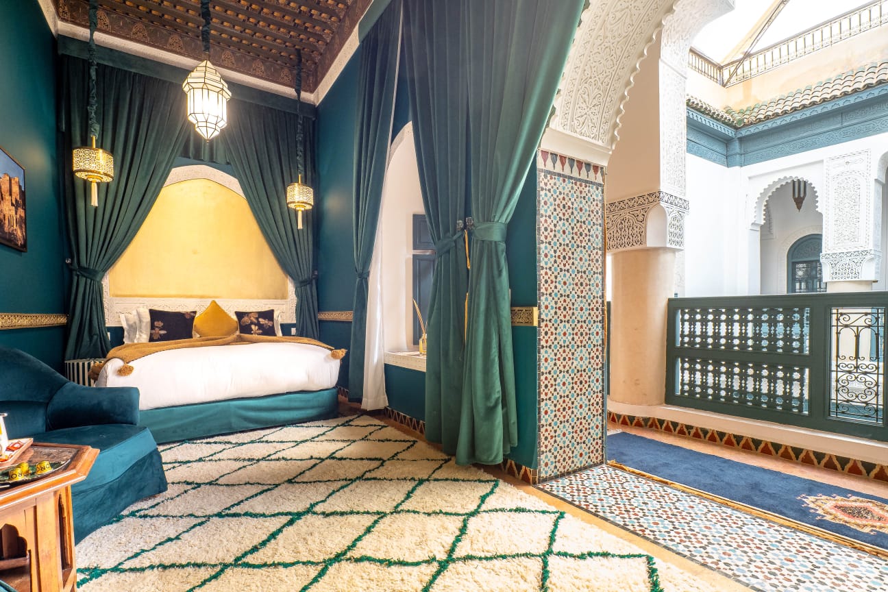 Dunes Suite with emerald velvet and gold decor and painted cedar wardrobes, Riad Dar Alhambra Marrakech