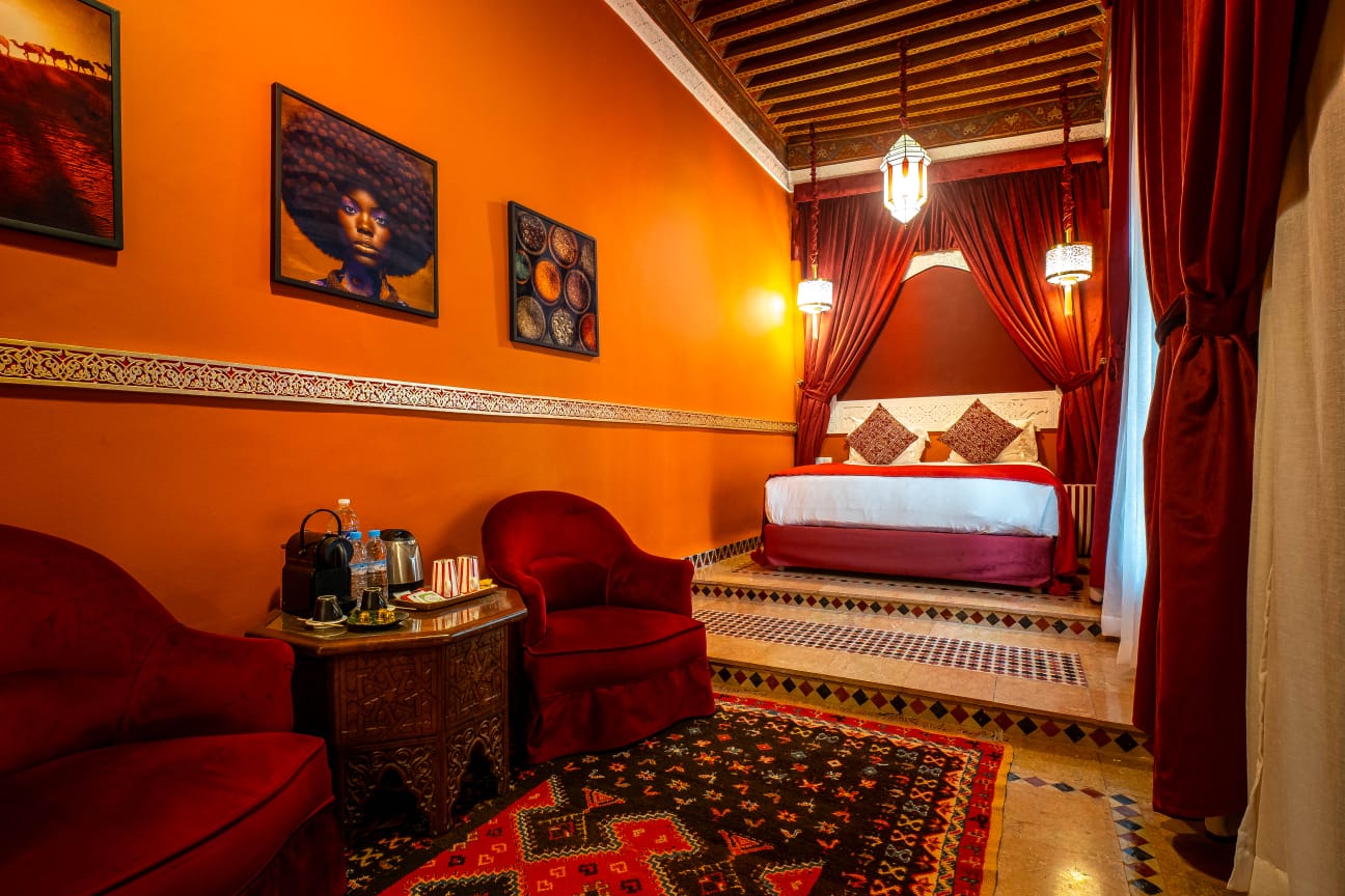 Royal Suite at Riad Dar Alhambra with hand-painted zouaq ceiling and stucco fireplace, Marrakech